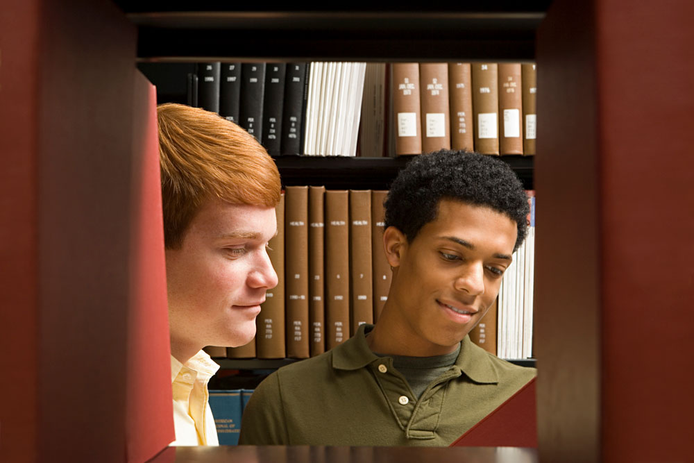 Older students researching in the library