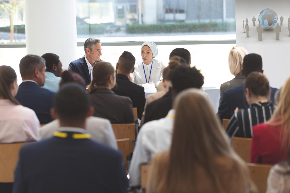 Room full of researchers at a researcher conference